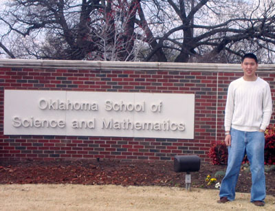 Caleb Li, discoverer of the world's 25th largest prime triplet stands in front of his school, The Oklahoma School of Science and Mathematics